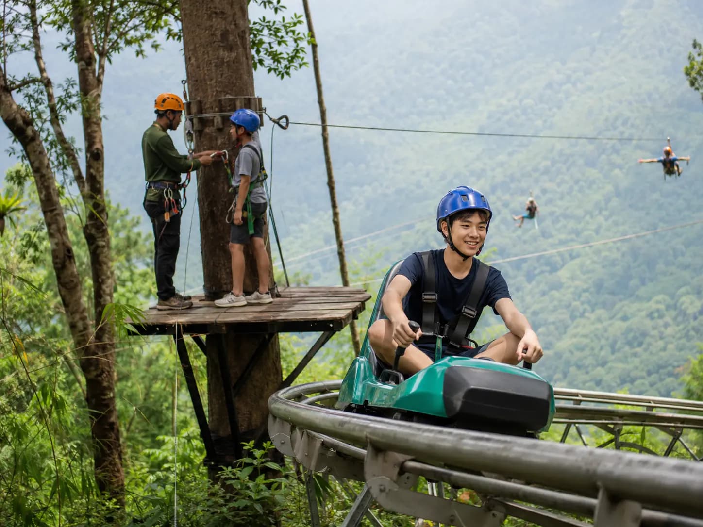 Conceptual editorial image of older children and teenagers on an outdoor forest adventure course.