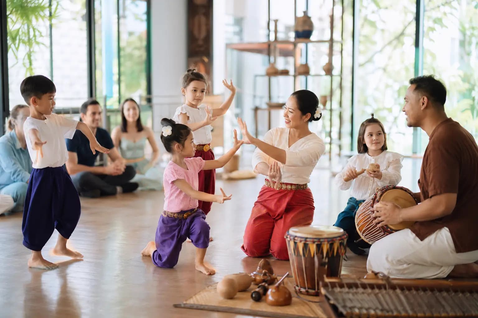 Children learning Thai-inspired dance and music in a conceptual cultural arts class.