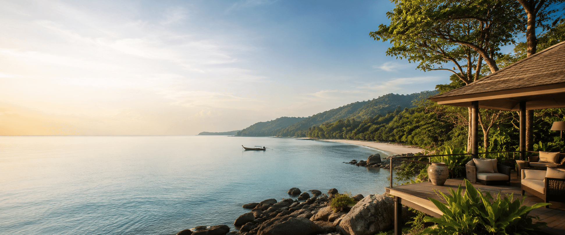 A calm beach scene at Koh Lanta with a family walking along the shoreline at sunset.